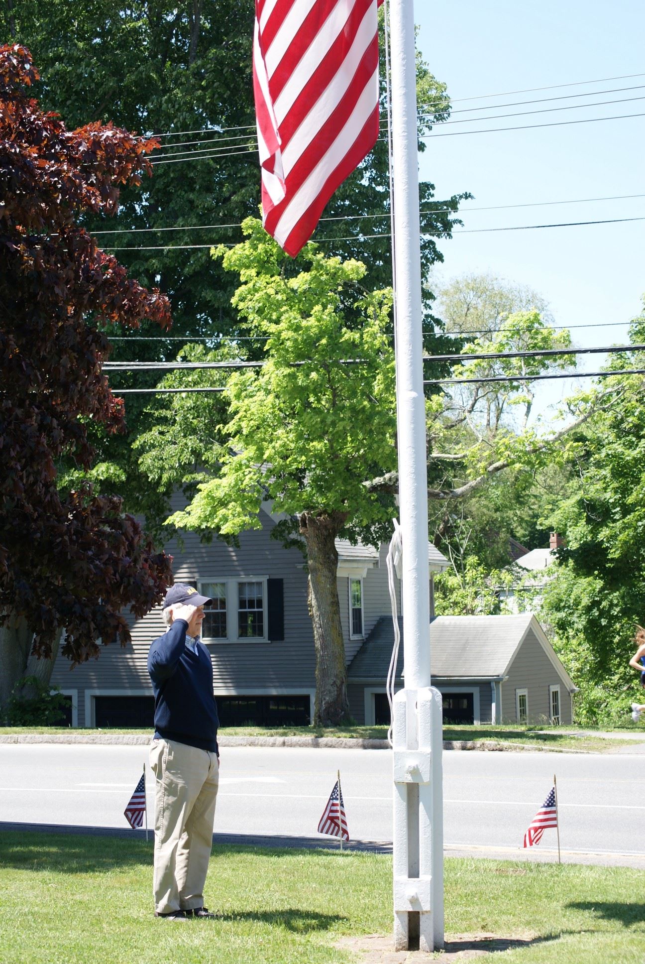 US Navy Veteran Mr. Asher salutes the flag